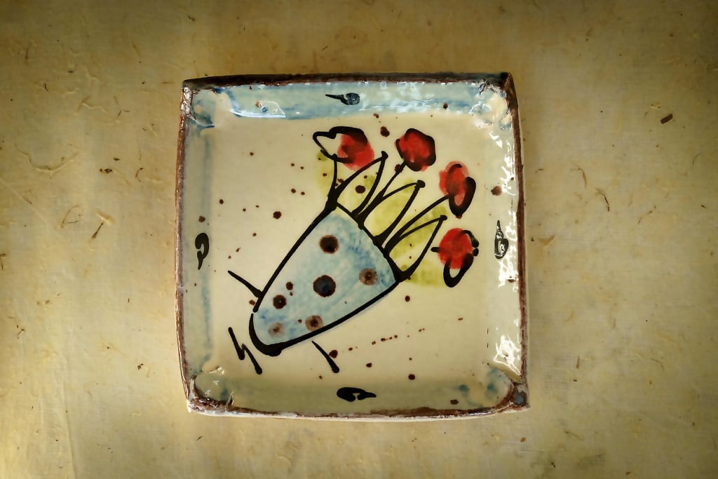 Square dish with vase