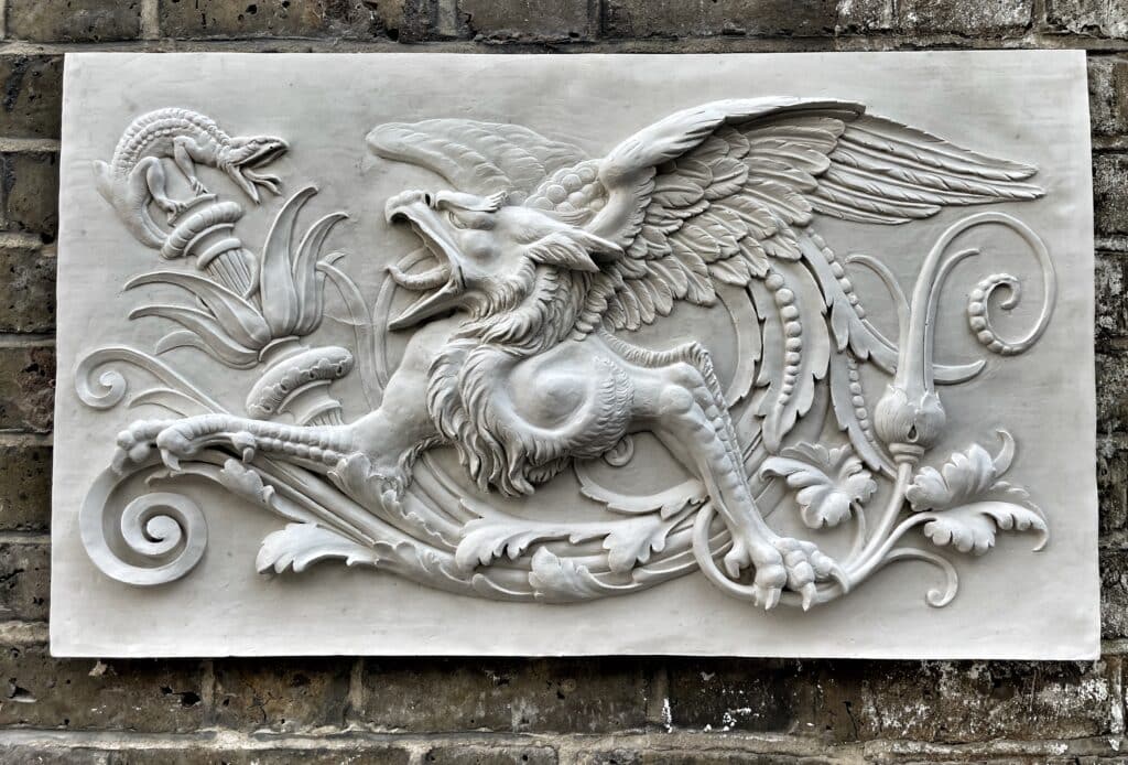 Grotesque image transformed into a low relief sculpture.