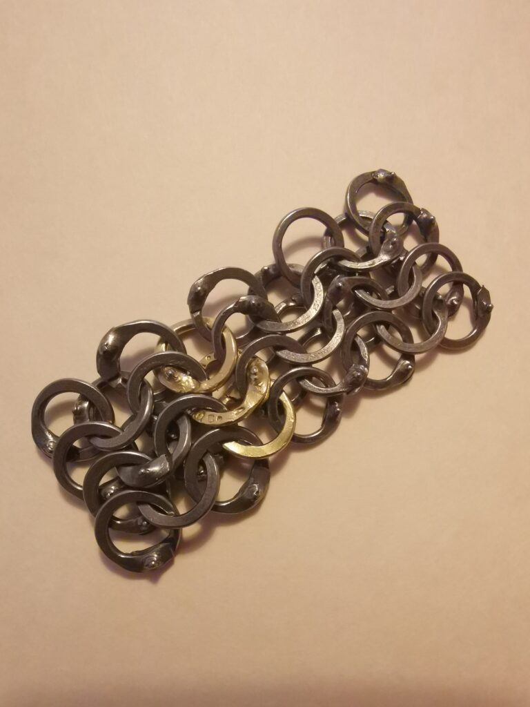 Riveted maille section