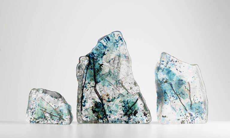 Sand cast Rock Made by Elin Isaksson Sand cast Rock sculptures in 3 sizes: S 8cm M 17cm  L26cm tall.  Solid glass sculptures, one side rough from the sand and front side glassy smooth. A ‘frozen’ collage of hand blown shards and stringers and copper and gold leaf. Every piece is unique.