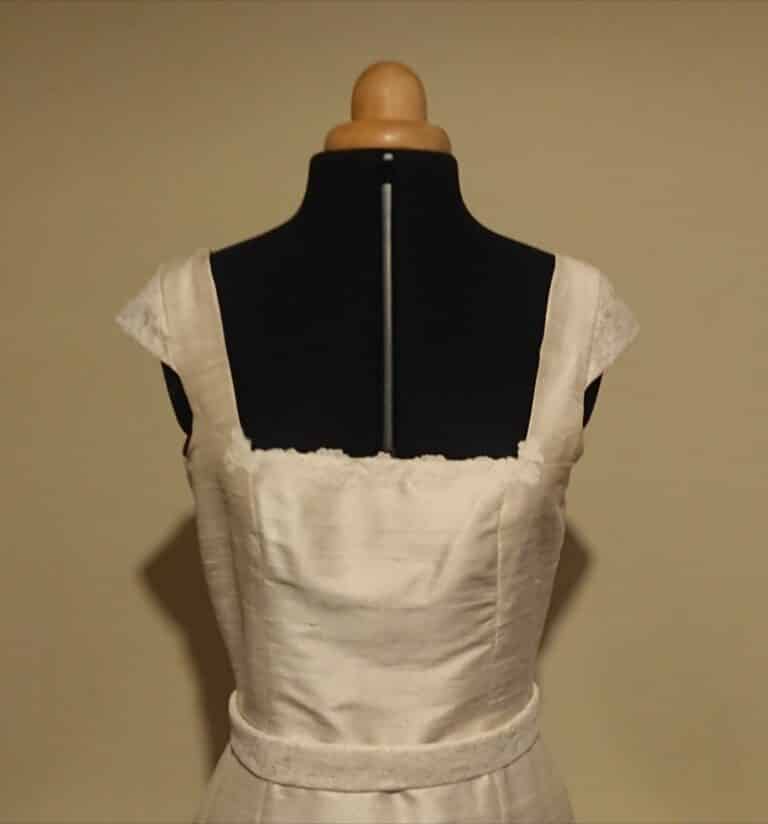 Silk wedding dress with lace Made by Anne Fontenoy Hand sewn and made of 100% silk dupion with cap sleeves, belt and neckline trimmed with English Leavers Lace.