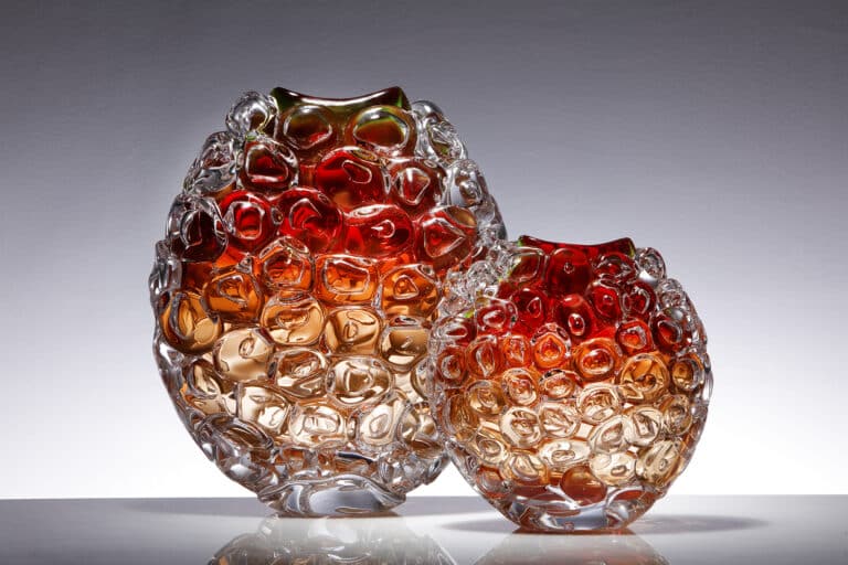 Bubble Wrap Ovoid Vases Made by Allister Malcolm Glass Limited The ascent to the surface brings with it a bitter sweet moment. As I exhale I watch large bubbles form and burst into hundreds of smaller variations as they overtake me in their race to the surface. I do not wish to beat them, the sooner I arrive at the surface the sooner my experience is over. Emerging from behind a cloud the sun’s rays give each bubble a halo. Ripples on the surface now become visible and I feel a warmth in the light near the surface. Diving offers a moment of complete escapism from our world.   These pieces evolve as I gain experience in diving. I’m fascinated by observations of how colour and light are effected at various depths and how this effects the state of mind.
