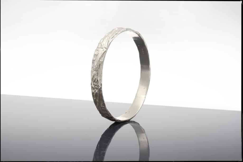 Carved silver bangle